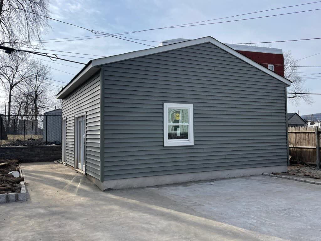 ADU roof and siding work in progress in Millburn, New Jersey