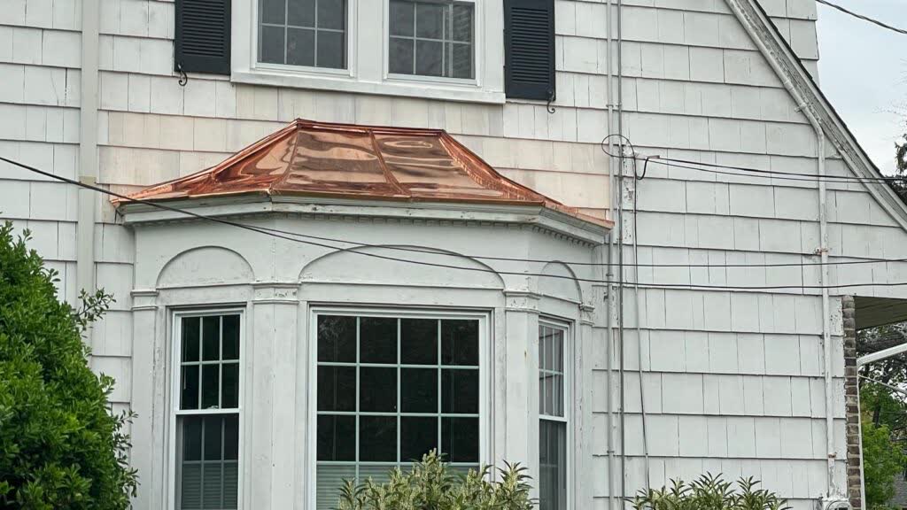 Roof and siding repair in progress in Montclair, New Jersey